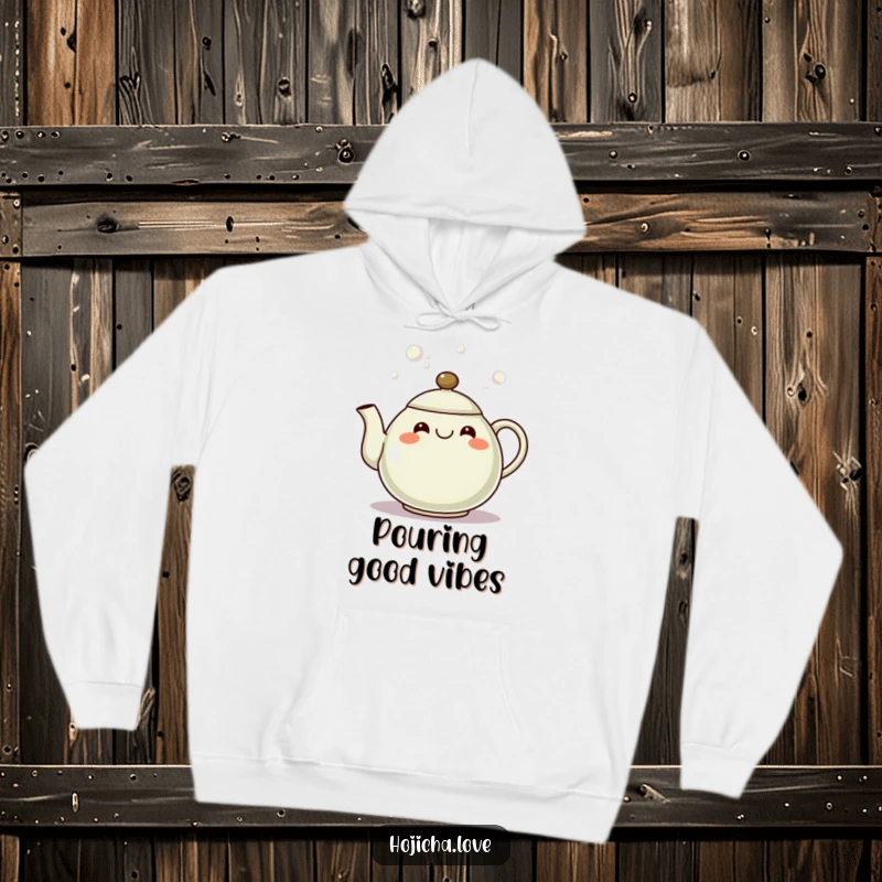 Funny hojicha teapot hoodie with a happy, grinning spout pouring bubbles, perfect for cozy, cheerful wear.