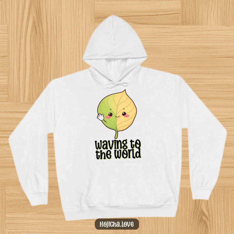 Funny hojicha leaf hoodie, cheerfully waving with simple eyes, offering warmth and a friendly, amusing vibe.
